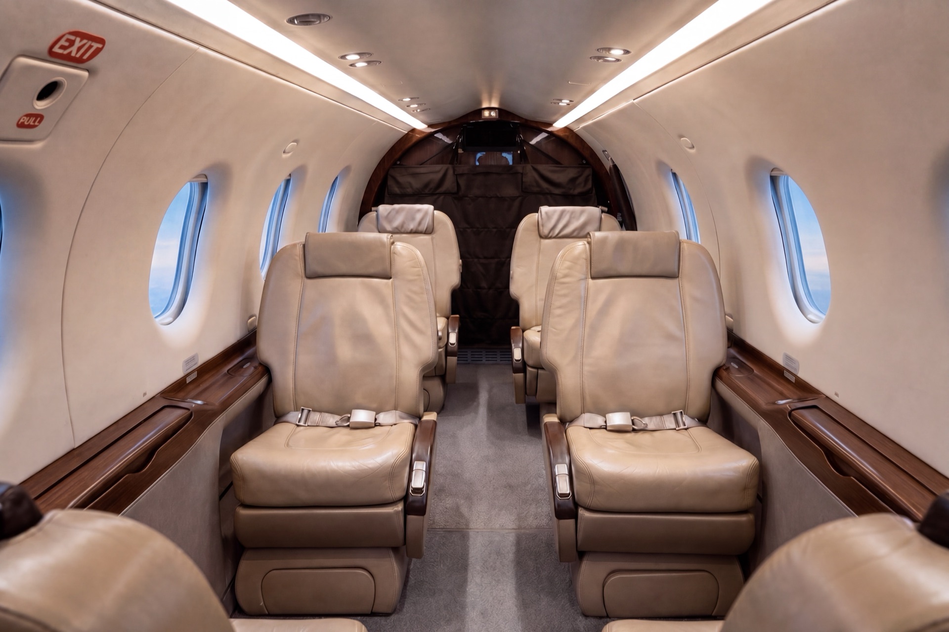 Pilatus PC‑12 cabin: executive seating down the aisle